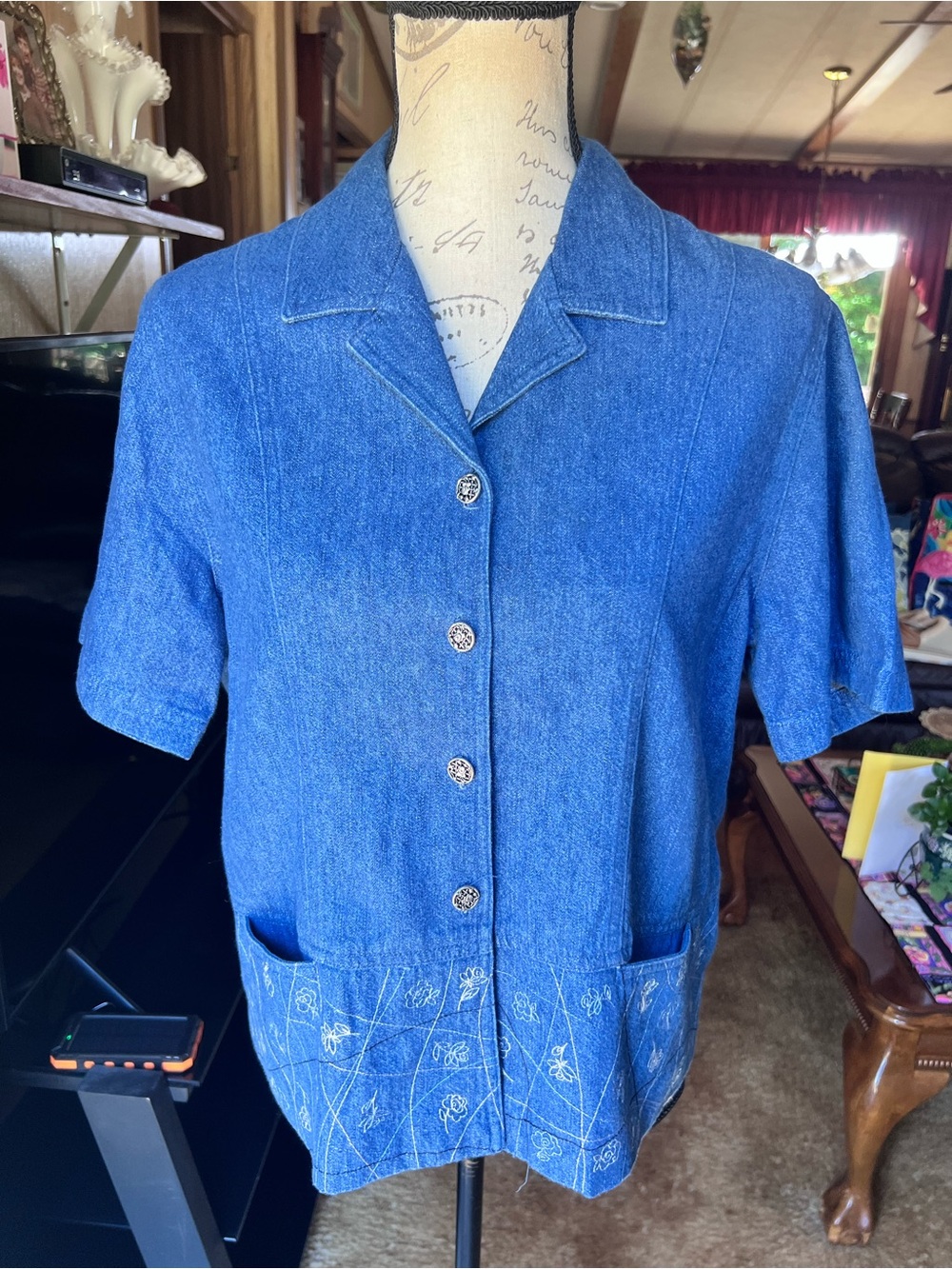 Woman’s Vintage C.L.C blue denim button-down shirt featuring floral patch pocket